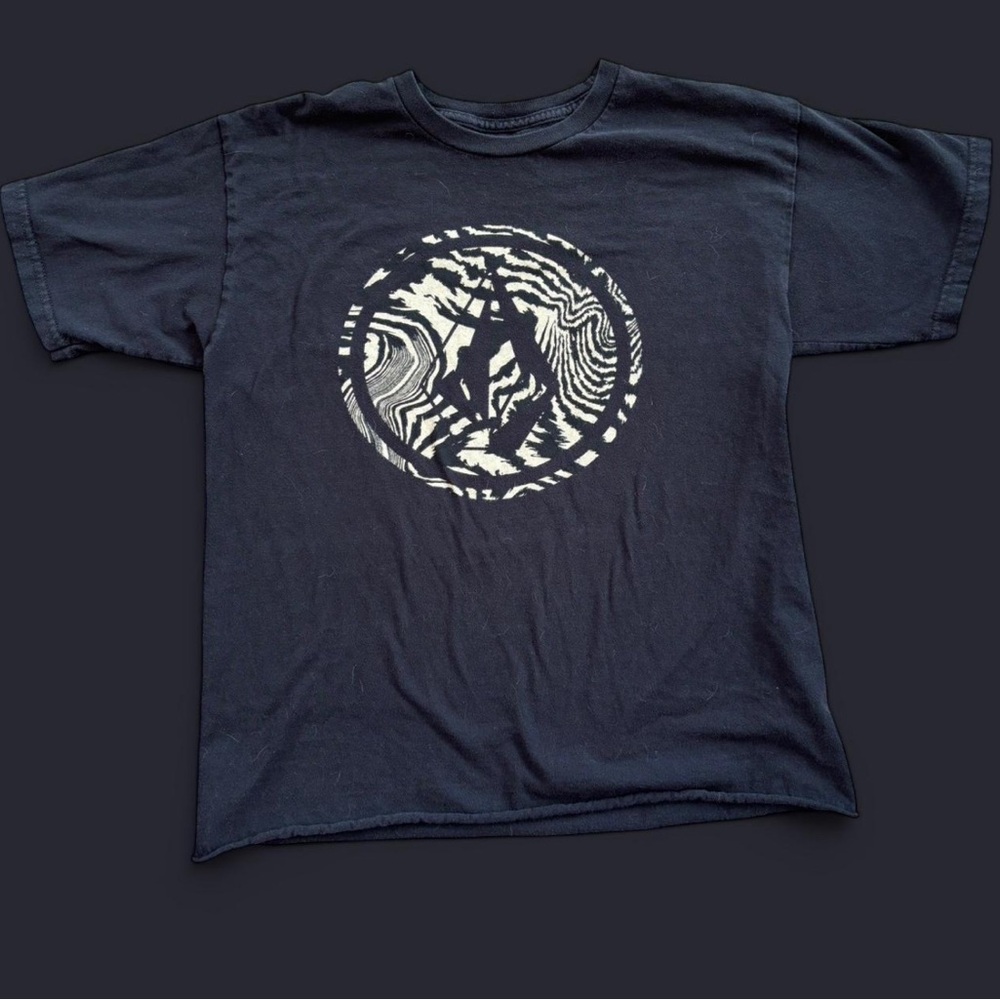 Black Volcom shirt with zebra like volcom print design